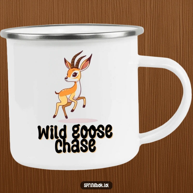 Funny springbok camping mug shows a playful springbok chasing its shadow, perfect for outdoor adventures and humor.