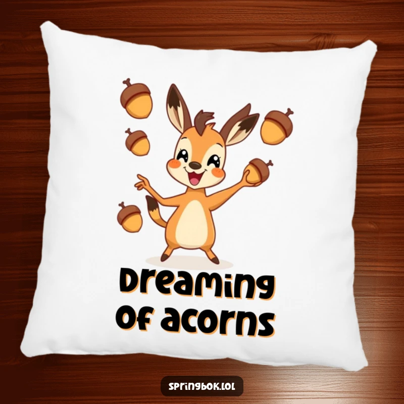 Funny springbok pillow showing a springbok gleefully tossing three acorns in the air, perfect for a cozy, humorous touch.