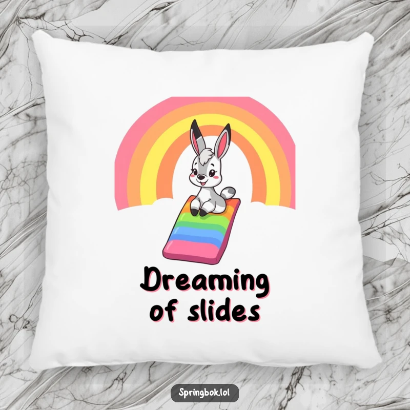 Funny springbok pillow, featuring a happy springbok sliding down a bright rainbow, offering comfort and a reminder of pure, unadulterated fun.