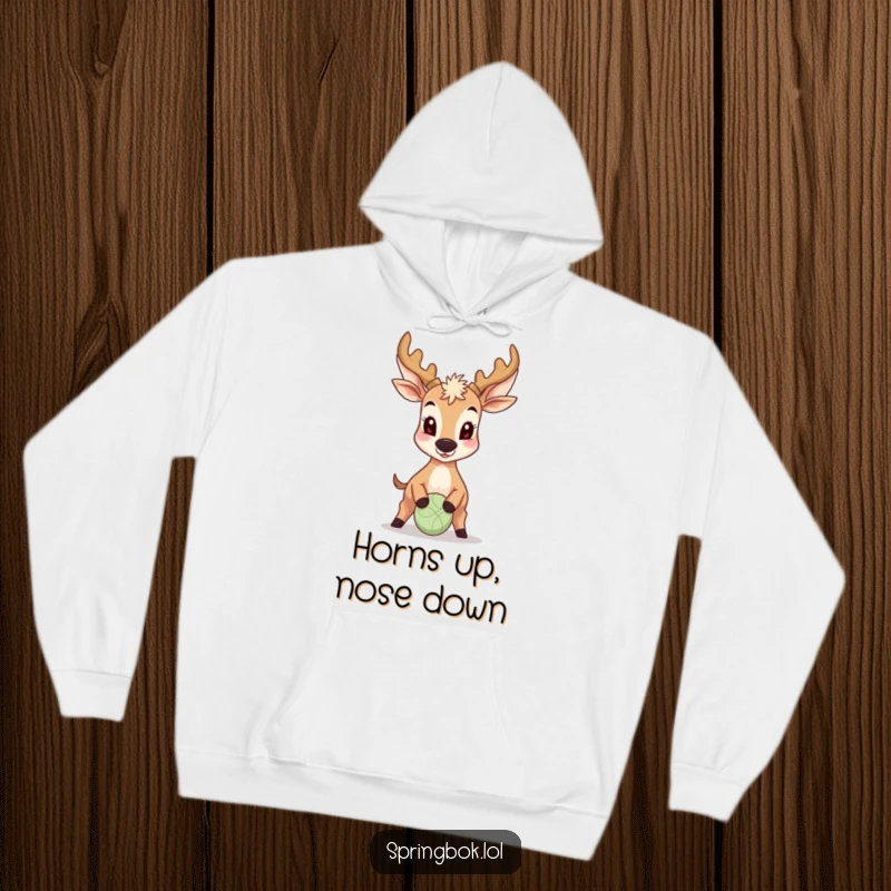 Funny Antelope Hoodie: A cheerful antelope uses its nose to bounce a tiny ball, showcasing a delightful and humorous athletic feat.