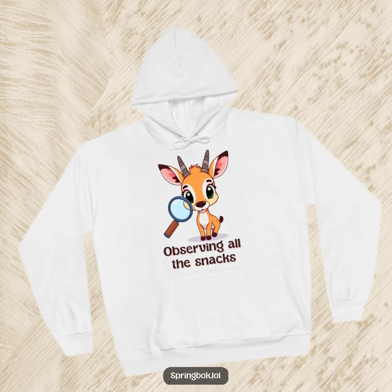 Funny springbok hoodie, a plush garment featuring a curious springbok peering through a large magnifying glass, radiating warmth and playful intelligence.