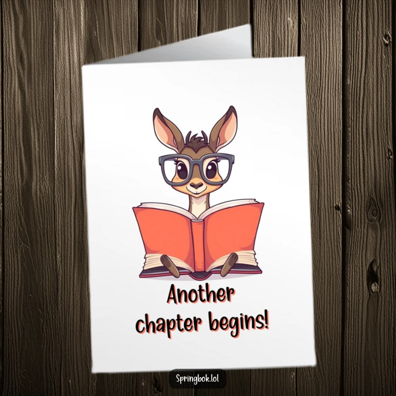 Funny Free Printable Birthday Card featuring a springbok in oversized glasses, engrossed in reading a massive, open book.