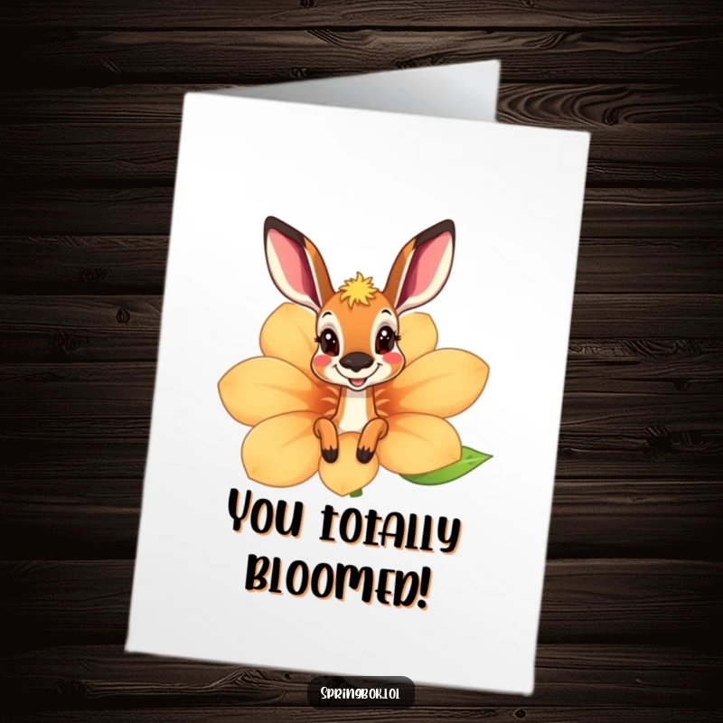Funny Free Printable Springbok Congrats Card peeking from a flower, conveying excitement and congratulations with a playful wink.