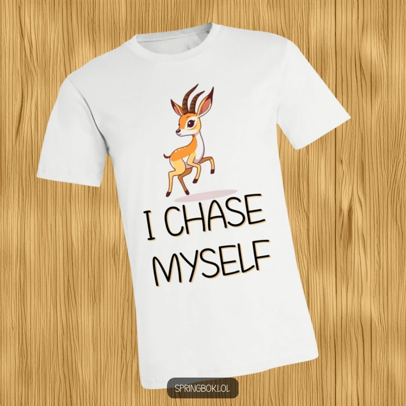 Funny springbok t-shirt features a playful springbok character energetically chasing its shadow, capturing outdoor fun.