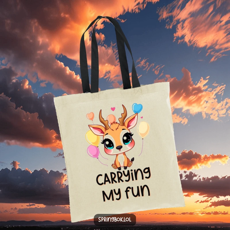 Funny springbok tote bag with large, happy eyes juggling colorful balloons, perfect for carrying items with a cheerful vibe.