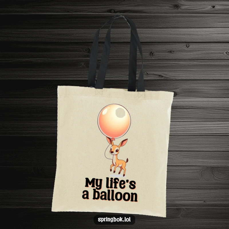 Funny Springbok Balloon Tote Bag: A springbok gleefully bouncing a big, shiny balloon, perfect for carrying essentials.